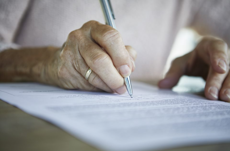 a woman filling out a form